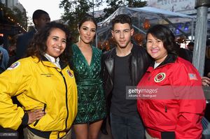 olivia-culpo-and-singer-nick-jonas-pose-with-city-year-americorps-at-picture-id471166736.jpg