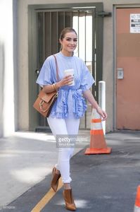 olivia-culpo-is-wearing-ports-1961-top-unravel-denim-chloe-bag-boots-picture-id541162034.jpg