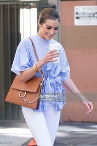 olivia-culpo-is-wearing-ports-1961-top-unravel-denim-chloe-bag-boots-picture-id541162036.jpg
