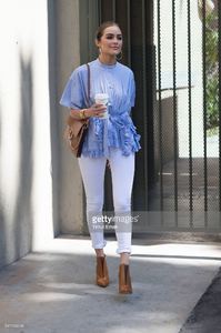 olivia-culpo-is-wearing-ports-1961-top-unravel-denim-chloe-bag-boots-picture-id541162046.jpg