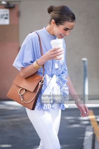olivia-culpo-is-wearing-ports-1961-top-unravel-denim-chloe-bag-boots-picture-id541162048.jpg