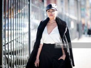 olivia-culpo-is-wearing-public-school-top-and-pants-eugenia-kim-hat-picture-id510290660.jpg