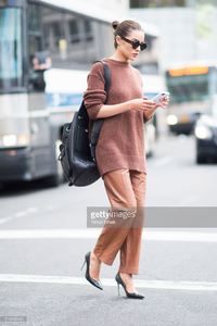 olivia-culpo-is-wearing-tibi-sweater-and-pants-marchesa-heels-celine-picture-id519456466.jpg