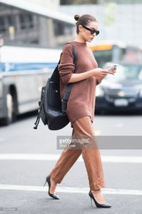 olivia-culpo-is-wearing-tibi-sweater-and-pants-marchesa-heels-celine-picture-id519456484.jpg