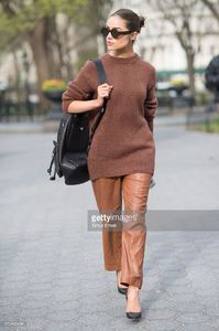 olivia-culpo-is-wearing-tibi-sweater-and-pants-marchesa-heels-celine-picture-id519456496.jpg