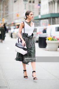 olivia-culpo-is-wearing-tods-skirt-and-bag-jbrand-tshirt-unravel-bra-picture-id519456440.jpg