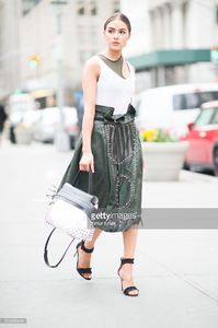 olivia-culpo-is-wearing-tods-skirt-and-bag-jbrand-tshirt-unravel-bra-picture-id519456448.jpg