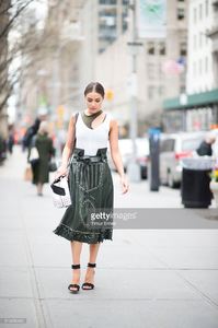 olivia-culpo-is-wearing-tods-skirt-and-bag-jbrand-tshirt-unravel-bra-picture-id519456480.jpg