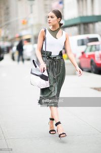 olivia-culpo-is-wearing-tods-skirt-and-bag-jbrand-tshirt-unravel-bra-picture-id519456500.jpg