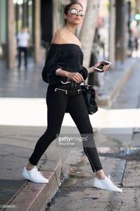olivia-culpo-is-wearing-unravel-suede-pants-tibi-top-common-projects-picture-id540886236.jpg