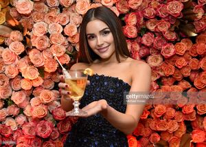olivia-culpo-poses-with-the-signature-cocktail-for-the-2017-golden-picture-id630857028.jpg