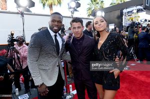 rapper-50-cent-recording-artist-nick-jonas-and-actress-olivia-culpo-picture-id473806346.jpg