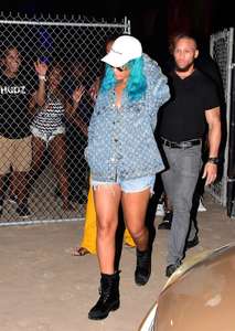 Rihanna--Wearing-a-turquoise-wig-at-a-carnival-event--02.jpg