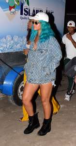 Rihanna--Wearing-a-turquoise-wig-at-a-carnival-event--07.jpg