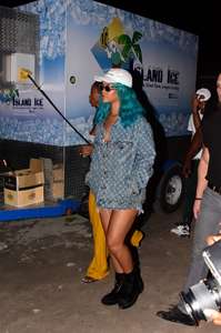 Rihanna--Wearing-a-turquoise-wig-at-a-carnival-event--26.jpg