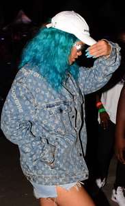 Rihanna--Wearing-a-turquoise-wig-at-a-carnival-event--39.jpg