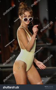 stock-photo-miami-fl-july-a-model-walks-the-runway-at-the-th-annual-style-saves-swim-fashion-show-in-702663496.jpg