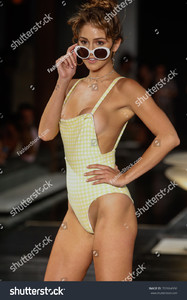 stock-photo-miami-fl-july-a-model-walks-the-runway-at-the-th-annual-style-saves-swim-fashion-show-in-702664936.jpg