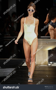 stock-photo-miami-fl-july-a-model-walks-the-runway-at-the-th-annual-style-saves-swim-fashion-show-in-702665158.jpg