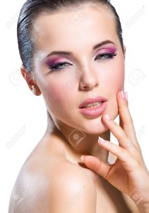 23353556-portrait-de-toucher-sa-face-nue-fille-avec-rose-maquillage-lumineux - Stock Photo.jpg