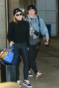 Chloe-Moretz and-Brooklyn-Beckham-at-JFK-Airport--09.jpg