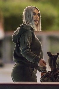 kim-kardashian-in-grey-hoodie-ice-skating-at-a-christmas-party-in-thousand-oaks-0.jpg