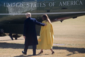 48E7E04600000578-5354089-RIGHT_THIS_WAY_Trump_escorted_his_wife_to_Marine_One-a-79_1517873735926.jpg