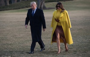 48E9394000000578-5354089-President_Trump_left_and_first_lady_Melania_Trump_right_walk_thr-a-77_1517873735919.jpg