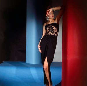 leticia-lucas-leaning-against-a-wall-and-wearing-a-long-black-evening-dress-with-flowered-lace-mid-d-with-earrings-and-a-bracelet-by-wendy-gell-vogue-1983.thumb.jpg.d643798af2622b3c7ecd6d6735d631d6.jpg