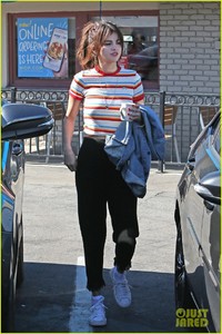 selena-gomez-grabs-breakfast-at-ihop-leaves-with-coffee-mug-06.jpg