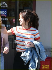 selena-gomez-grabs-breakfast-at-ihop-leaves-with-coffee-mug-07.jpg