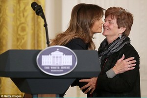 49B56F0C00000578-5451531-Melania_Trump_embraces_Betty_Henderson_whose_son_died_of_an_opio-a-16_1519938319115.jpg