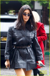 kourtney-kardashian-shows-off-some-leg-in-short-leather-trench-coat-04.jpg