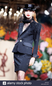 yves-saint-laurent-paris-haute-couture-spring-summer-model-wearing-black-skirt-suit-gold-button-lace-scarf-round-black-hat-X22HJB.jpg