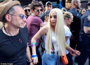 4D9A204E00000578-5881461-Couple_of_cuties_Gaga_marched_with_her_fiance_Christian_Carino-a-27_1529963281579.jpg
