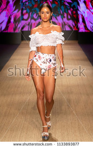 stock-photo-miami-beach-fl-july-a-model-walks-the-runway-at-the-agua-bendita-collection-during-the-1133893877.jpg