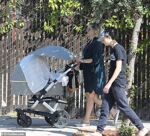 5489980-6324989-That_s_her_boy_Ryder_strolled_alongside_his_mom_as_she_pushed_hi-a-41_1540708990090.jpg
