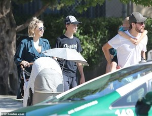 5490038-6324989-Blended_family_Danny_gave_Bingham_a_piggyback_ride_during_the_lo-a-37_1540708989965.jpg