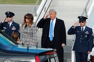 5589454-6332041-Touch_down_Trump_salutes_as_he_departs_Air_Force_One_on_his_way_-a-48_1540931925185.jpg