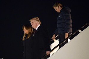 6632556-6428081-The_Trumps_are_seen_above_walking_down_the_steps_of_Air_Force_On-a-77_1543194719436.jpg