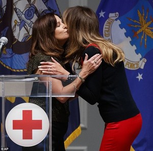 6710344-6434677-Karen_Pence_and_Melania_Pence_share_a_hug_before_they_pack_care_-m-29_1543344123382.jpg