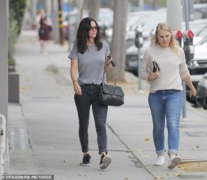 6775366-6440747-Walk_and_talk_The_actress_enjoyed_a_relaxed_outing_with_a_female-a-52_1543457324422.jpg