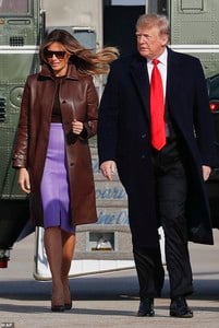 6811638-6443845-In_good_spirits_Melania_had_a_smile_on_her_face_during_their_tra-a-2_1543530644590.jpg