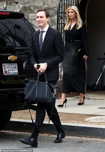 7043622-6469355-Good_mood_Despite_the_somber_mood_of_the_day_Ivanka_and_Jared_bo-a-6_1544144638999.jpg