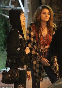 7232786-6479039-Stunning_Paris_wrapped_a_black_and_white_checked_scarf_around_he-a-68_1544445760361.jpg