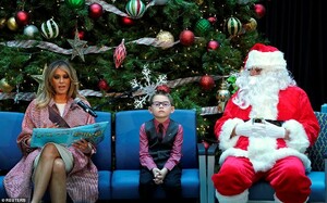 7394982-0-Melania_Trump_sat_beside_Nathan_Simm_and_Santa_Clause_while_read-a-64_1544729123846.jpg