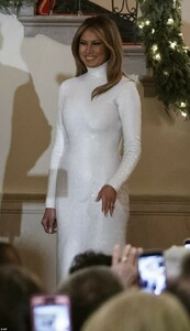 7480374-6508691-All_smiles_Melania_48_looked_dazzling_in_a_white_sequin_gown_by_-a-3_1545154544505.jpg