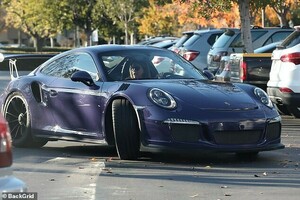 7597250-6510255-Away_she_goes_Jenner_drove_away_in_her_purple_Porsche-a-29_1545184291536.jpg