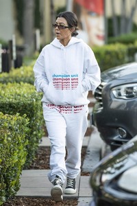 kourtney-kardashian-in-grey-sweatsuit-hoodie-black-high-top-sneakers-and-dark-sunglasses-12-02-2018-2.jpg