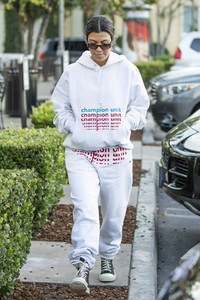 kourtney-kardashian-in-grey-sweatsuit-hoodie-black-high-top-sneakers-and-dark-sunglasses-12-02-2018-4.jpg